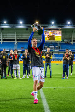 Magnus Retsius Grødem of Molde celebrates with the trophy