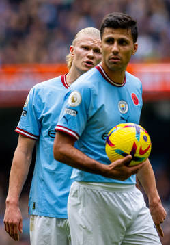 Erling Braut Haaland and Rodri of Manchester City