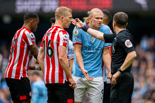 Erling Braut Haaland of Manchester City argues with Peter