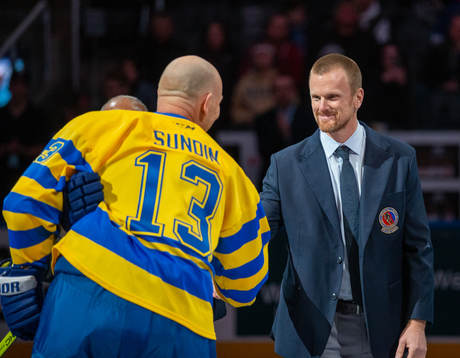 Mats Sundin and Daniel Sedin shake hands following a