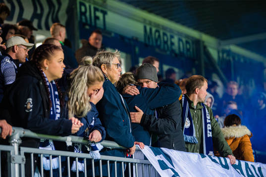 Spectators in the stands looks dejected