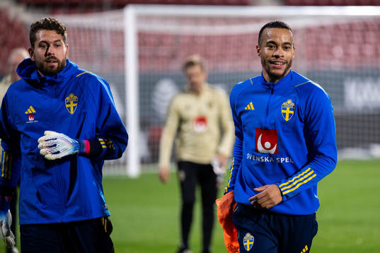 Goalkeeper Robin Olsen and Robin Quaison of the Swedish