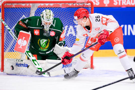 goaltender Dennis Hildeby  of Färjestad and Ales Jergi of