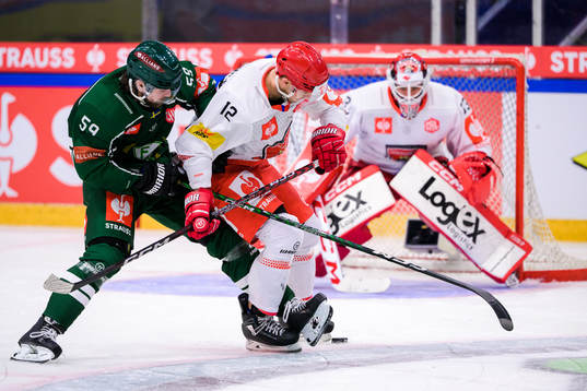 Linus Johansson of Färjestad and Graeme McCormack of