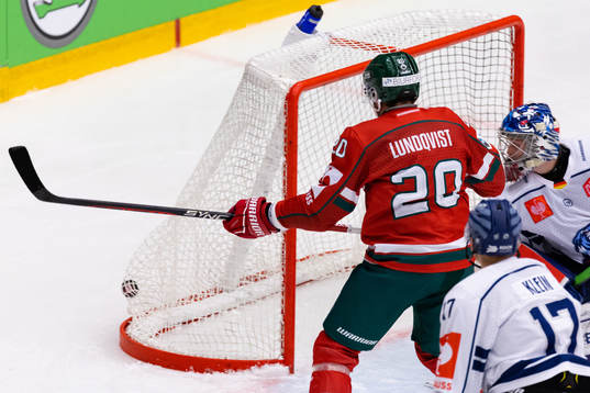 Joel Lundqvist of Frölunda scores 1-0 behind goalkeeper