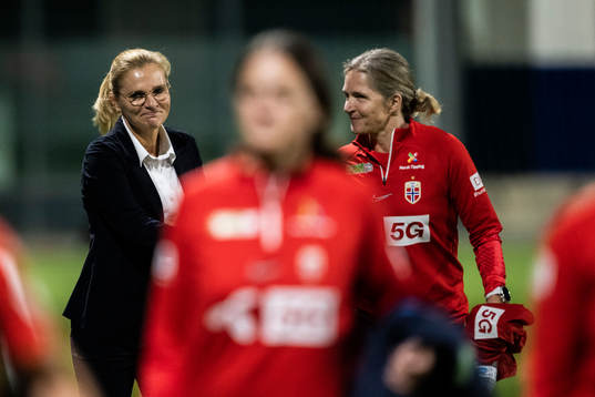 Head coach Sarina Wiegman of England and Head coach Hege