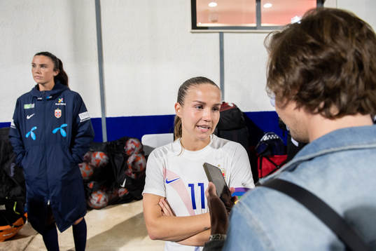 Guro Reiten of Norway is interviewed by the media