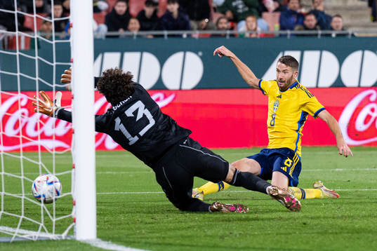 Marcus Rohdén of Sweden scores the 0-1 goal behind
