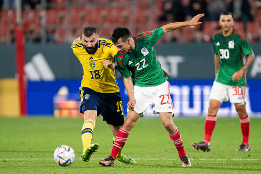 Mikael Ishak of Sweden and Hirving Lozano of Mexico