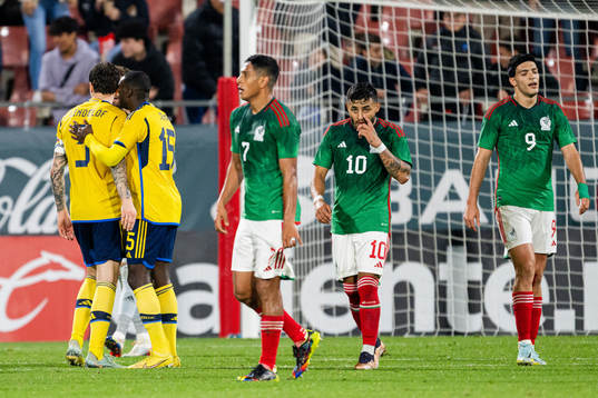 Luis Romo, Alexis Vega and Raul Jimenez of Mexico look