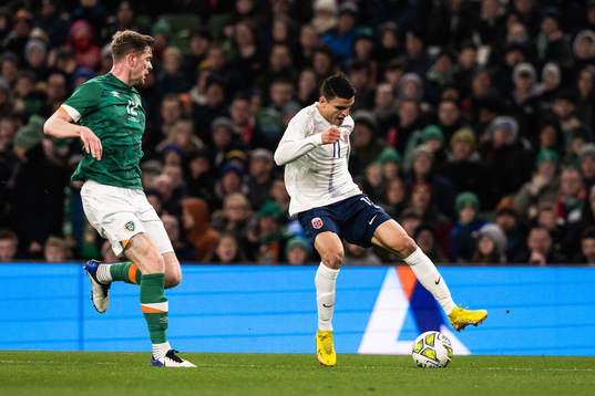 Nathan Collins of Ireland and goalkeeper Mads Hedenstad