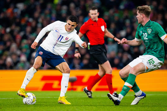 Mohamed Elyounoussi of Norway and Nathan Collins of Ireland