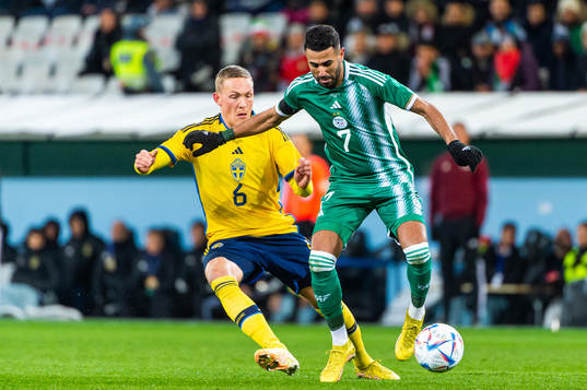 Ludwig Augustinsson of Sweden and Riyad Mahrez of Algeria