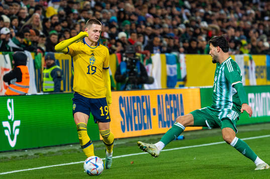 Mattias Svanberg of Sweden and Ramy Bensebaini of Algeria