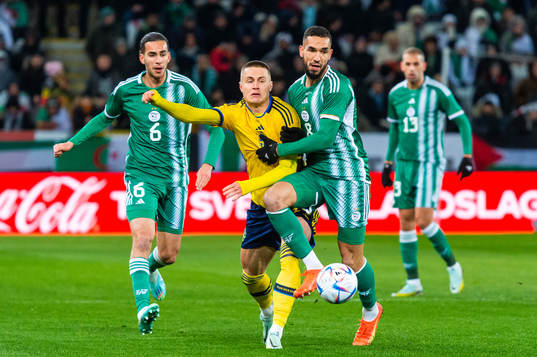 Mattias Svanberg of Sweden and Nabil Bentaleb of Algeria