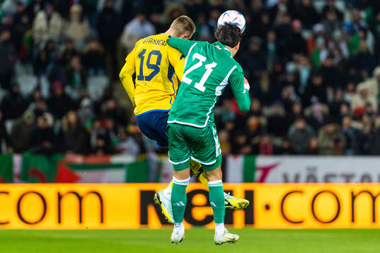 Mattias Svanberg of Sweden and Ramy Bensebaini of Algeria