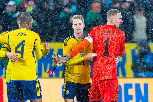 Samuel Gustafson and goalkeeper Robin Olsen of Sweden