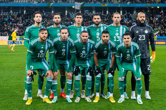 The starting eleven of Algeria pose for a picture