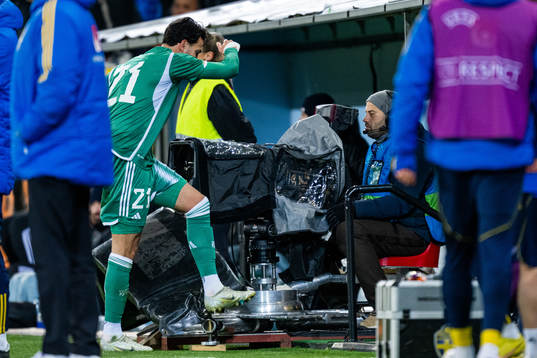 Ramy Bensebaini of Algeria reacts