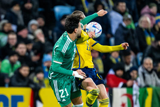 Ramy Bensebaini of Algeria and Mattias Svanberg of Sweden