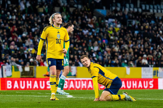 Emil Forsberg and Jesper Karlström of Sweden look dejected