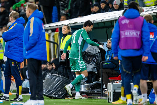Ramy Bensebaini of Algeria reacts