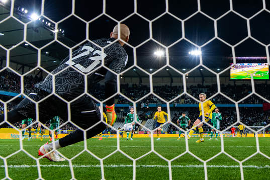 Emil Forsberg of Sweden scores 1-0 behind goalkeeper Rais