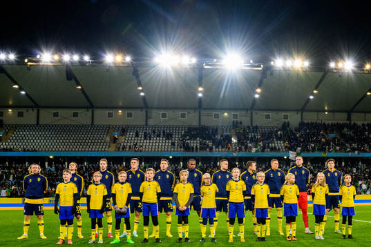 Players line up with player escorts