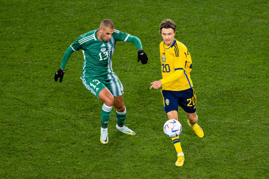 Islam Slimani of Algeria and Kristoffer Olsson of Sweden