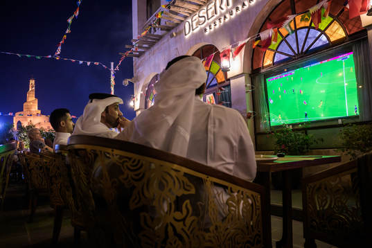 People watch the FIFA World Cup 2022 football match between