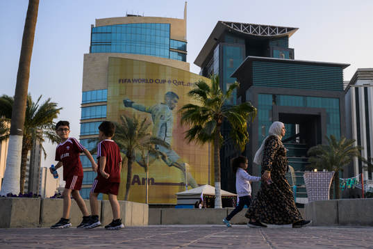 People walk past advertising
