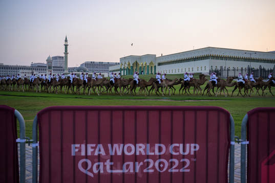 Camels riding in front of government office Amiri Diwan