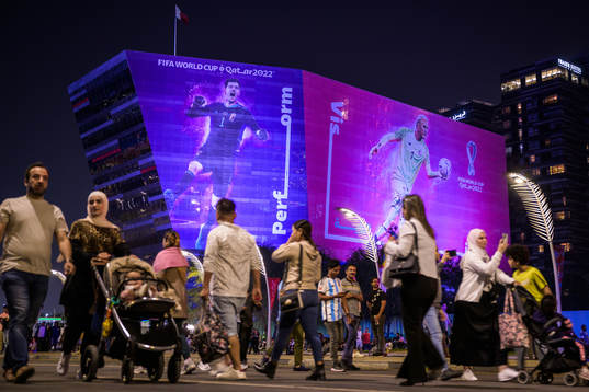 People walk past advertising