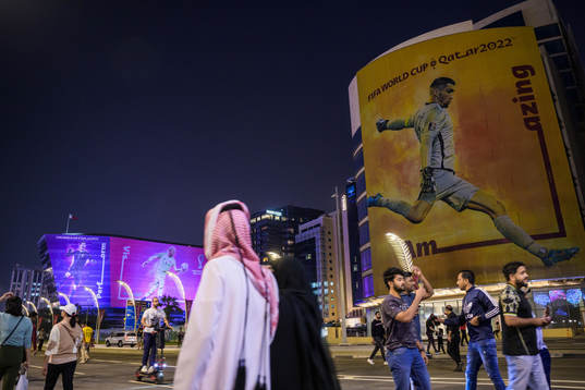 People walk past advertising