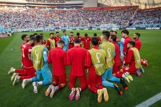 Players of Iran pray