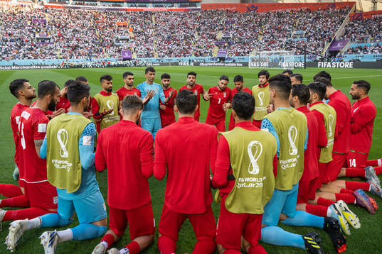 Players of Iran pray