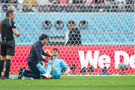 Goalkeeper Alireza Beiranvand of Iran receives medical