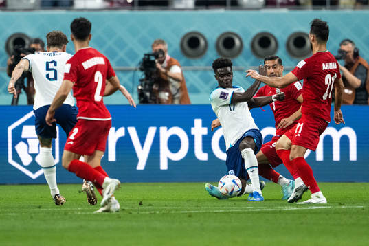 Bukayo Saka of England and Ehsan Hajisafi and Ahmad