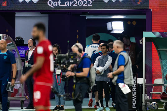 Harry Maguire of England receives medical attention