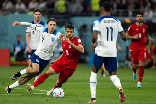 Jack Grealish of England and Morteza Pouraliganji of Iran