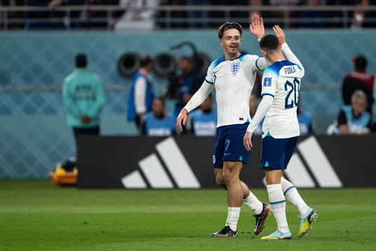 Jack Grealish and Phil Foden of England celebrate 6-1