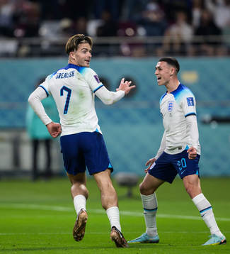 Jack Grealish and Phil Foden of England celebrate the 6-1