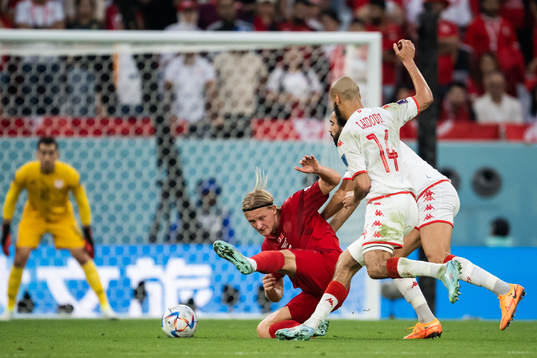 Kasper Dolberg of Denmark against Yassine Meriah and Aissa