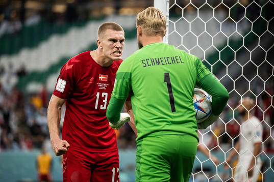 Rasmus Kristensen and goalkeeper Kasper Schmeichel of