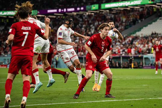 Joachim Andersen of Denmark and Ellyes Skhiri of Tunisia