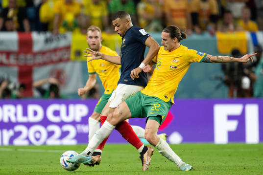 Kylian Mbappe of France and Jackson Irvine of Australia