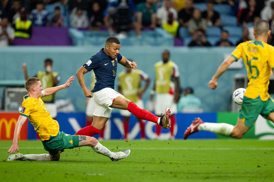 Kye Rowles of Australia and Kylian Mbappe of France