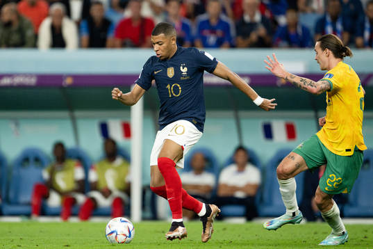 Kylian Mbappe of France and Jackson Irvine of Australia
