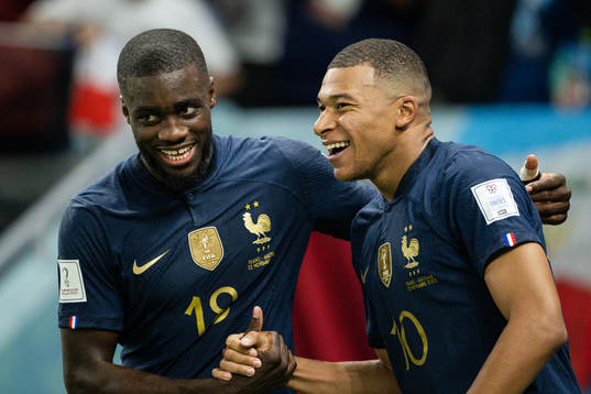 Dayot Upamecano and Kylian Mbappe of France celebrate the