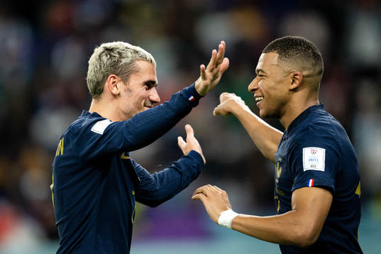 Antoine Griezmann and Kylian Mbappe of France celebrate the